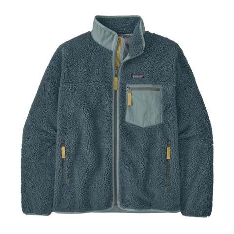 A Patagonia fleece jacket in a muted teal-blue color, featuring a light blue-gray chest pocket with a yellow zipper pull, and matching light blue-gray trim on the collar and front zipper.
