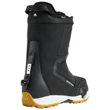 Black snowboard boot with yellow sole on a white background