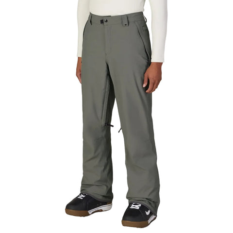 A person wearing grey snowboard pants 