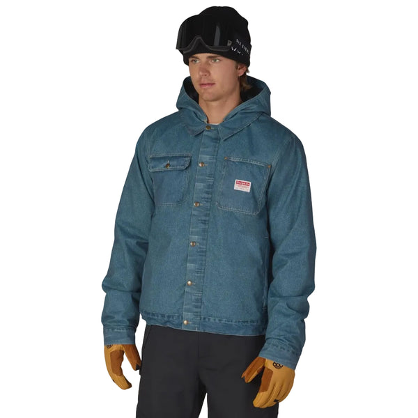 A man wearing a blue hooded denim jacket, standing against a solid white background.
