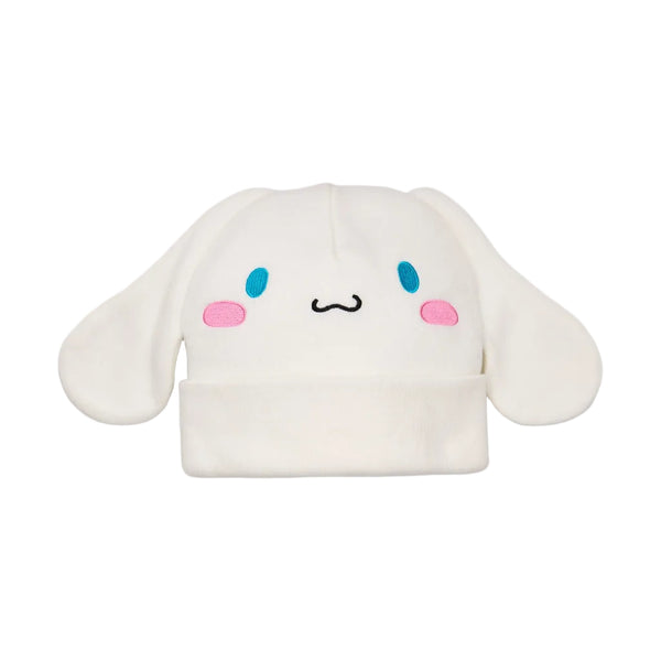 A white plush Cinnamoroll hat with blue eyes, pink cheeks, and a black stitched mouth