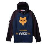 A Fox Racing pullover hoodie with a navy blue body, dark purple sleeves and hood, featuring a large orange Fox head logo on the chest, a front zip pocket with a yellow zipper, and white text down the sleeves, displayed against a dark background.