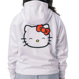 A person shown from the back wearing a white hoodie with a large Hello Kitty face graphic on the back, featuring a red bow and black outline. 