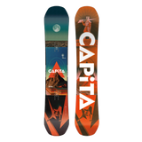 Two views of a CAPiTA snowboard shown side by side on a plain white background. The left view shows the base with a dark teal-to-orange scenic graphic and the CAPiTA logo, while the right view shows the orange topsheet with large white CAPiTA lettering and a stylized rider graphic.