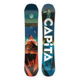 Two views of a CAPiTA snowboard shown side by side on a plain white background: the topsheet face on the left and the base on the right. The design features a dark teal-to-blue gradient with a moon graphic, a mountain and orange geometric shapes, and large white CAPiTA lettering on the base.