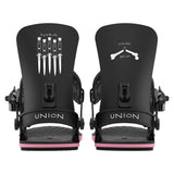 Black snowboard bindings with pink accents on a white background