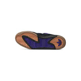 A single shoe shown from the sole view, featuring a black upper, a purple chevron-patterned midsole, and a brown gum outsole with a Adidas logo on the heel.