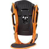 A snowboard binding shown from the back, featuring a black textured plastic base with an orange frame and a black footplate.