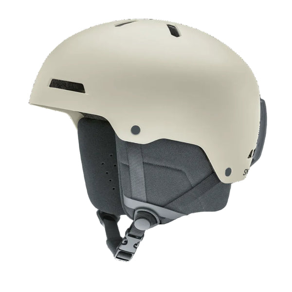 A matte off-white ski helmet with dark gray interior padding and straps, shown from a three-quarters angle on a solid white background.