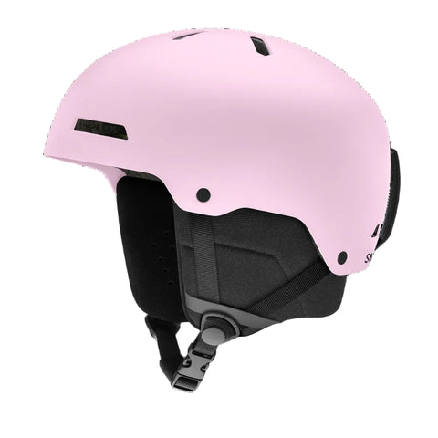 A matte light pink ski helmet with black interior padding and straps, shown from a three-quarters angle on a solid white background.